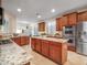 Large kitchen island with granite countertops and stainless steel appliances at 2602 W Trapanotto Rd, Phoenix, AZ 85086