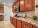 Kitchen boasts granite counters, ample cabinetry, and gas cooktop at 2602 W Trapanotto Rd, Phoenix, AZ 85086