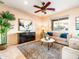 Bright living room with comfy sofas, a coffee table, and large window at 2602 W Trapanotto Rd, Phoenix, AZ 85086