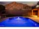 Night view of backyard pool and mountain at 2602 W Trapanotto Rd, Phoenix, AZ 85086