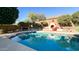 Inviting pool with fireplace and patio at 2602 W Trapanotto Rd, Phoenix, AZ 85086