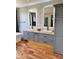 Elegant bathroom with double sinks and lighted vanity at 28414 N 101St Pl, Scottsdale, AZ 85262