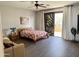 Bright bedroom with a comfortable bed and access to a balcony at 28414 N 101St Pl, Scottsdale, AZ 85262