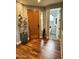 Entryway with hardwood floors and view of powder room at 28414 N 101St Pl, Scottsdale, AZ 85262