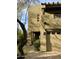 Tan stucco two-story home with a walkway leading to the entrance at 28414 N 101St Pl, Scottsdale, AZ 85262