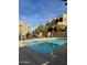 Inviting community pool with lounge chairs and umbrellas at 28414 N 101St Pl, Scottsdale, AZ 85262