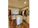 Spacious walk-in closet with custom shelving and island at 28414 N 101St Pl, Scottsdale, AZ 85262