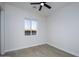 Well-lit bedroom with wood-look floors and a window at 29456 N 208Th Ln, Wittmann, AZ 85361