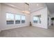 Bright dining room with large windows and modern chandelier at 29456 N 208Th Ln, Wittmann, AZ 85361