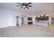 Open concept kitchen with island and stainless steel appliances at 29456 N 208Th Ln, Wittmann, AZ 85361