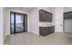 Laundry room with modern cabinets and tile flooring at 29456 N 208Th Ln, Wittmann, AZ 85361