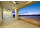 Spacious covered patio with ceiling fans and stunning sunset views at 29456 N 208Th Ln, Wittmann, AZ 85361