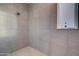 Large walk-in shower with neutral tone tile at 29456 N 208Th Ln, Wittmann, AZ 85361