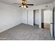 Bedroom with ceiling fan and lots of closet space at 31027 W Bellview St, Buckeye, AZ 85396