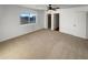 Well-lit bedroom with a large window and closet at 31027 W Bellview St, Buckeye, AZ 85396