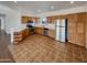 Bright kitchen with stainless steel appliances and wood cabinets at 31027 W Bellview St, Buckeye, AZ 85396