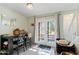 Bright dining area with view to backyard through french doors at 3511 E Baseline Rd # 1243, Phoenix, AZ 85042