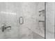 Modern shower with marble tile, built-in shelves, and glass enclosure at 3511 E Baseline Rd # 1243, Phoenix, AZ 85042