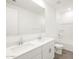 Bright bathroom featuring double sinks, a large mirror, and a shower-tub combination at 35581 N Thicket Way, San Tan Valley, AZ 85144