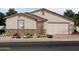 One-story home with a two-car garage and desert landscaping at 35581 N Thicket Way, San Tan Valley, AZ 85144