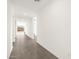 Bright hallway with neutral paint and ceramic tile leading to the main rooms of the house at 35581 N Thicket Way, San Tan Valley, AZ 85144