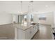 Spacious kitchen island with granite countertops and stainless steel appliances at 35581 N Thicket Way, San Tan Valley, AZ 85144