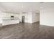 This open-concept living room showcases modern tile floors and seamless access to the kitchen at 35581 N Thicket Way, San Tan Valley, AZ 85144