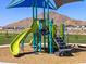 Community playground with slides, climbing wall, and ladder with mountain views, offering a fun and active play area at 35581 N Thicket Way, San Tan Valley, AZ 85144