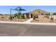 A vibrant community playground and picnic area, complete with benches and a scenic mountain view in the background at 35581 N Thicket Way, San Tan Valley, AZ 85144