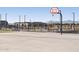 Community basketball court with mountain views, landscaping and shaded benches at 37042 W Prado St, Maricopa, AZ 85138