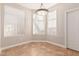 Bright dining area with three windows and light tile floor at 3830 E Lakewood Pkwy # 1114, Phoenix, AZ 85048