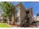 Exterior view of a two-story condo with a staircase and landscaping at 3830 E Lakewood Pkwy # 1114, Phoenix, AZ 85048