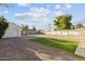 Landscaped backyard with artificial turf and storage shed at 3850 N 12Th Ave, Phoenix, AZ 85013