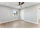 Spacious bedroom featuring wood-look floors and a window at 3850 N 12Th Ave, Phoenix, AZ 85013