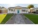 Newly renovated home with artificial turf and a herringbone walkway at 3850 N 12Th Ave, Phoenix, AZ 85013