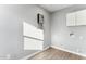 Laundry room with linoleum flooring and white cabinets at 3850 N 12Th Ave, Phoenix, AZ 85013