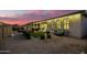 Backyard at dusk with patio furniture and fire pit at 39725 N Hailey Ln, San Tan Valley, AZ 85140