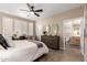 Bright bedroom with ensuite bathroom and ceiling fan at 39725 N Hailey Ln, San Tan Valley, AZ 85140