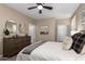 Spacious bedroom with ensuite bathroom and ceiling fan at 39725 N Hailey Ln, San Tan Valley, AZ 85140