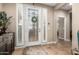 Bright entryway with decorative glass door and tile flooring at 39725 N Hailey Ln, San Tan Valley, AZ 85140