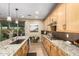 Bright kitchen with granite countertops, gas cooktop, and ample cabinetry at 39725 N Hailey Ln, San Tan Valley, AZ 85140