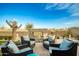 Seating area with fire pit and desert plants at 39725 N Hailey Ln, San Tan Valley, AZ 85140