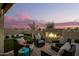 Relaxing patio area with firepit and seating at 39725 N Hailey Ln, San Tan Valley, AZ 85140