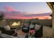 Relaxing patio area with firepit and seating at 39725 N Hailey Ln, San Tan Valley, AZ 85140