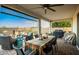 Covered patio with dining table and built-in grill at 39725 N Hailey Ln, San Tan Valley, AZ 85140