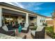 Covered patio with comfortable seating and a dining area at 39725 N Hailey Ln, San Tan Valley, AZ 85140