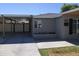 Modern home exterior with gray siding and a covered carport at 416 N Orange --, Mesa, AZ 85201