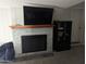 Living room fireplace with a mantel and built-in shelving at 416 N Orange --, Mesa, AZ 85201