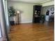 Bright living room with hardwood floors and a bookcase at 416 N Orange --, Mesa, AZ 85201