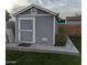 Gray storage shed with white trim and double doors at 416 N Orange --, Mesa, AZ 85201